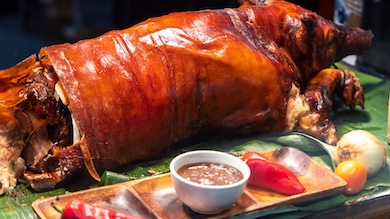 A traditional Filipino feast featuring lechon, a roasted whole pig, served during festivals, fiestas, and special celebrations.